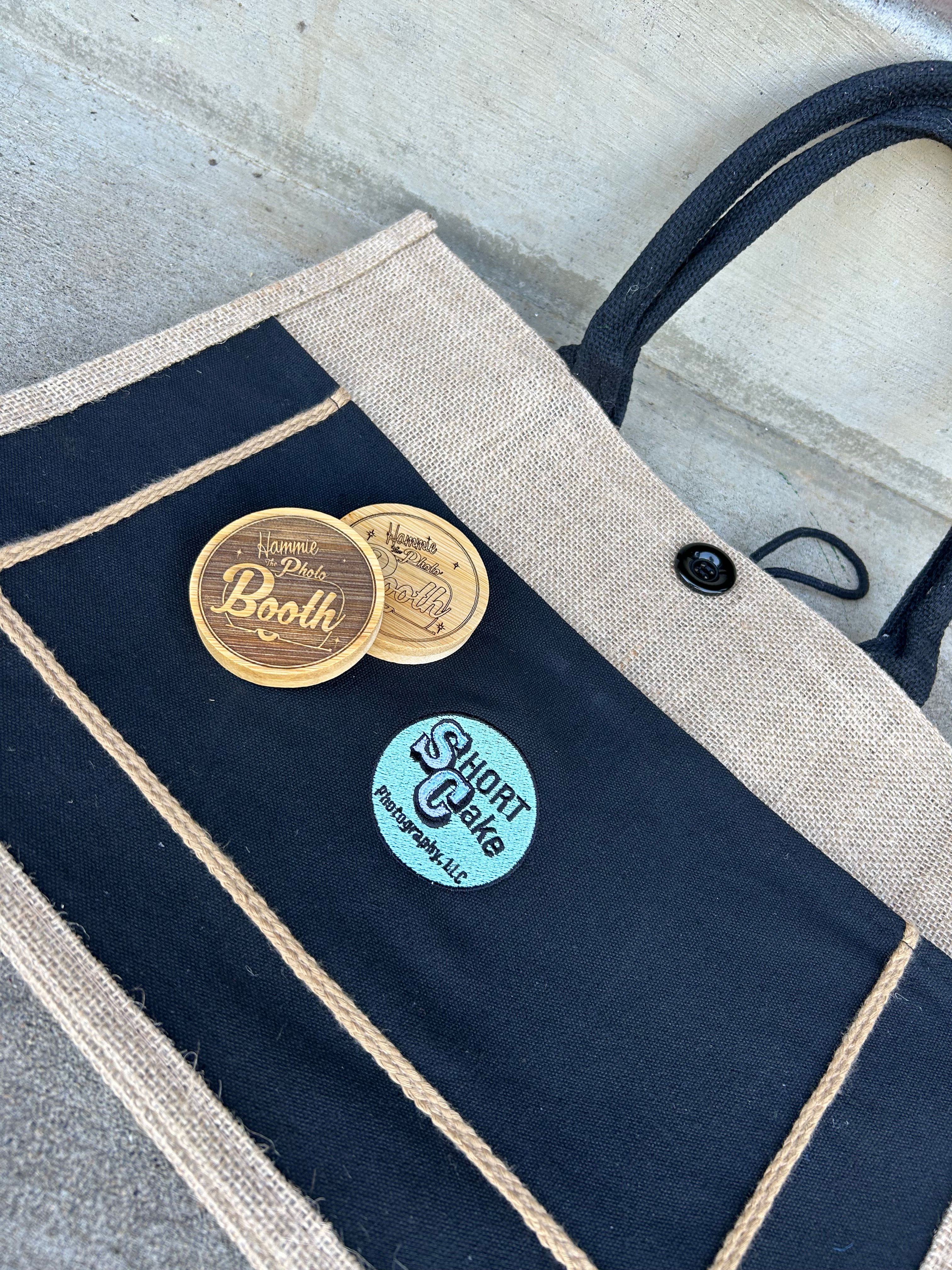 Laser engraved wooden coasters and embroidered tote bag showcasing branded products